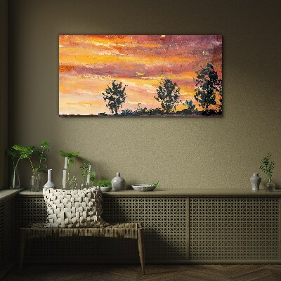 Foto op glas Zonsondergang boven de bomen