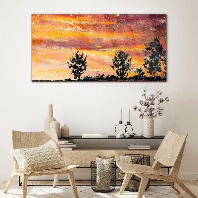 Foto op glas Zonsondergang boven de bomen