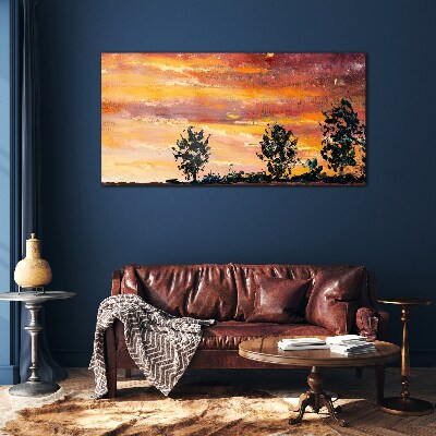 Foto op glas Zonsondergang boven de bomen