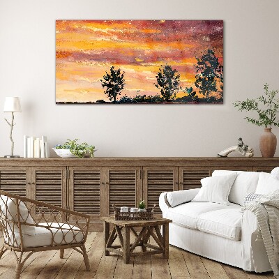 Foto op glas Zonsondergang boven de bomen