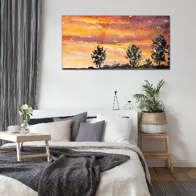 Foto op glas Zonsondergang boven de bomen