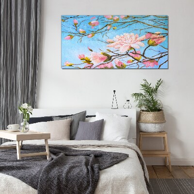 Glas foto Magnoliabloemen op een blauwe achtergrond