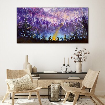 Foto op glas De magie van een avondkampvuur in het bos