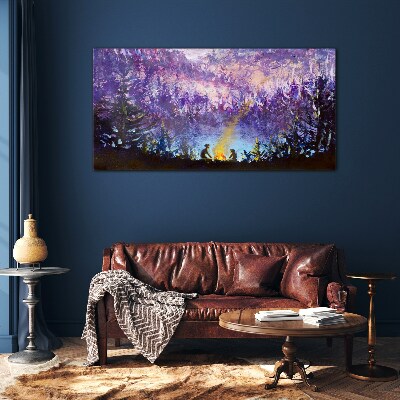 Foto op glas De magie van een avondkampvuur in het bos