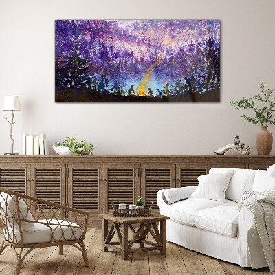 Foto op glas De magie van een avondkampvuur in het bos