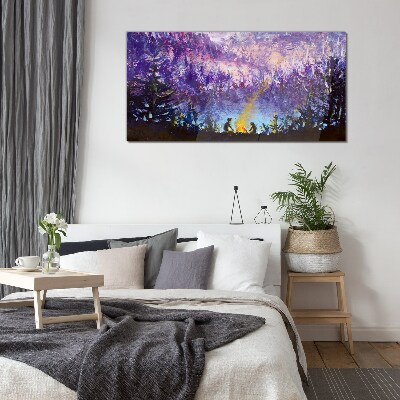 Foto op glas De magie van een avondkampvuur in het bos