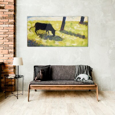 Glas foto Een koe graast in een groen landschap