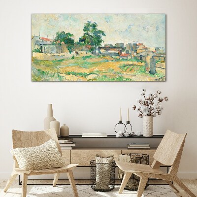 Foto op glas Landschap met een boom en gebouwen