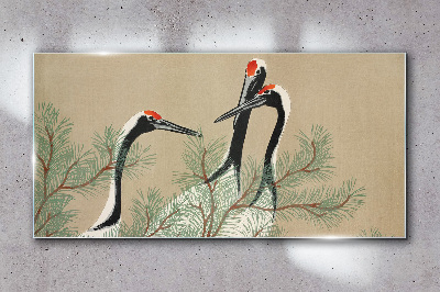 Schilderij op glas Drie kraanvogels tussen de dennentakken