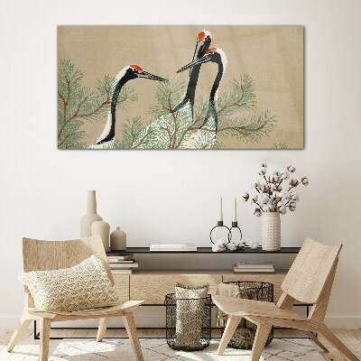 Schilderij op glas Drie kraanvogels tussen de dennentakken