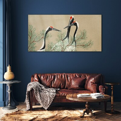 Schilderij op glas Drie kraanvogels tussen de dennentakken