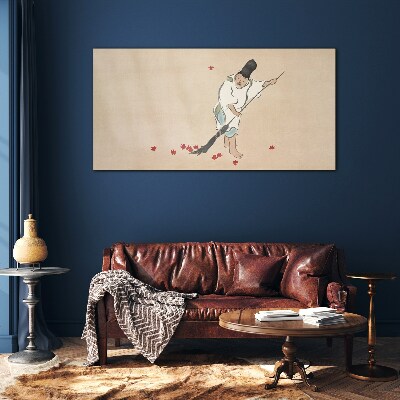 Foto op glas Monnik schoonmaken met bladeren