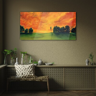 Schilderij op glas Zonsondergang over een groene heuvel