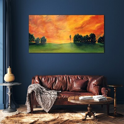 Schilderij op glas Zonsondergang over een groene heuvel