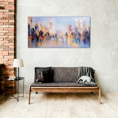 Foto op glas De stad in de gloed van de zonsondergang