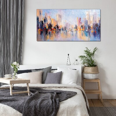 Foto op glas De stad in de gloed van de zonsondergang