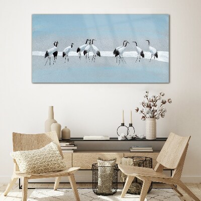 Schilderij op glas Zwermen kraanvogels op een blauwe achtergrond