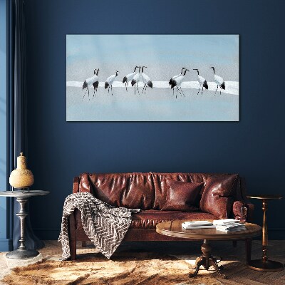 Schilderij op glas Zwermen kraanvogels op een blauwe achtergrond
