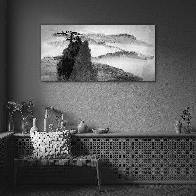 Foto op glas Een eenzame boom op een rotsachtige berg