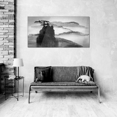 Foto op glas Een eenzame boom op een rotsachtige berg