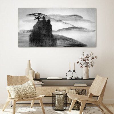 Foto op glas Een eenzame boom op een rotsachtige berg