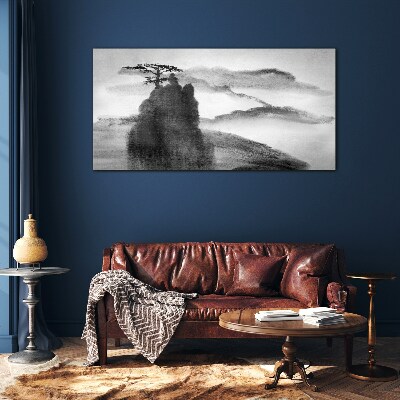 Foto op glas Een eenzame boom op een rotsachtige berg