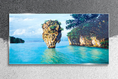 Foto op glas Een kalme baai met een hoge rots