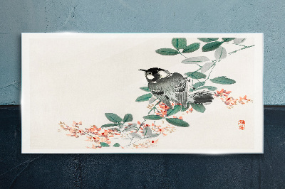 Glas foto Een vogel tegen een achtergrond van bloemen