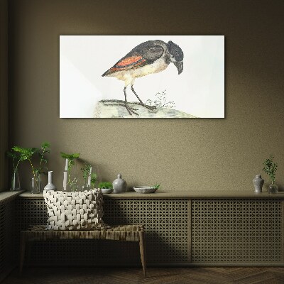 Foto op glas Een vogel tegen een natuurlijke achtergrond