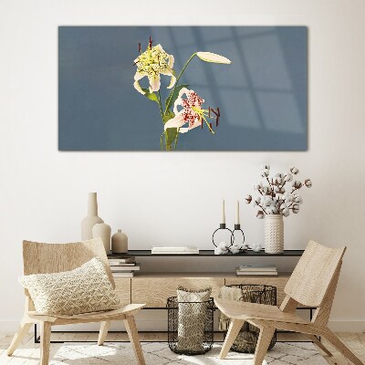 Foto op glas Bloemen op een blauwe achtergrond