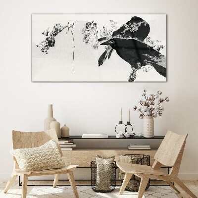 Foto op glas Een zwarte vogel tegen de achtergrond van de natuur