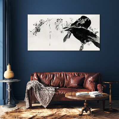 Foto op glas Een zwarte vogel tegen de achtergrond van de natuur