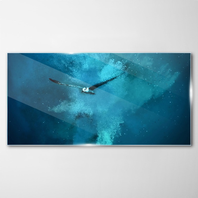 Foto op glas Een vogel in de blauwe ruimte