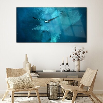 Foto op glas Een vogel in de blauwe ruimte