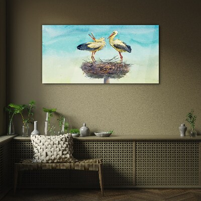 Glas foto Ooievaars op een nest in het blauw
