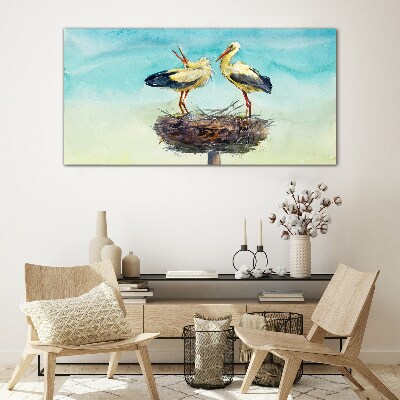 Glas foto Ooievaars op een nest in het blauw