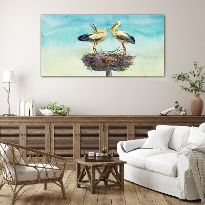 Glas foto Ooievaars op een nest in het blauw