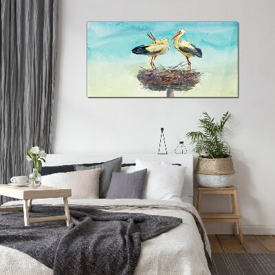 Glas foto Ooievaars op een nest in het blauw