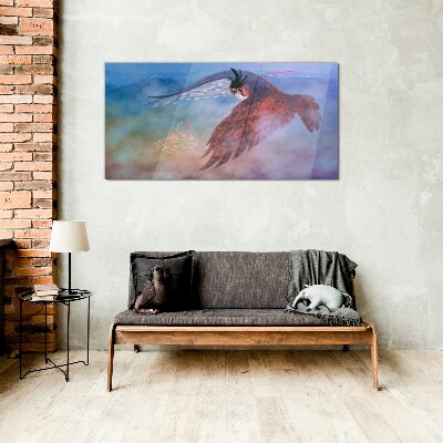 Schilderij op glas Vlucht van een roofvogel in de wolken