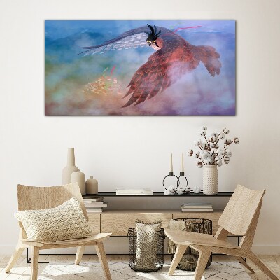 Schilderij op glas Vlucht van een roofvogel in de wolken