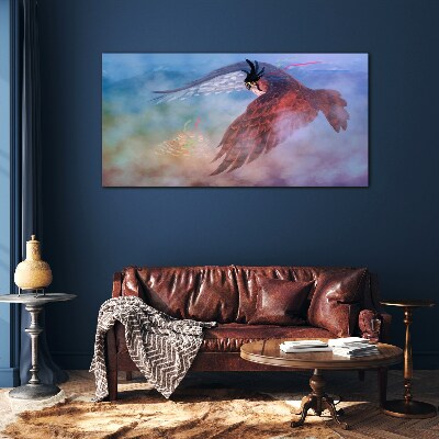 Schilderij op glas Vlucht van een roofvogel in de wolken