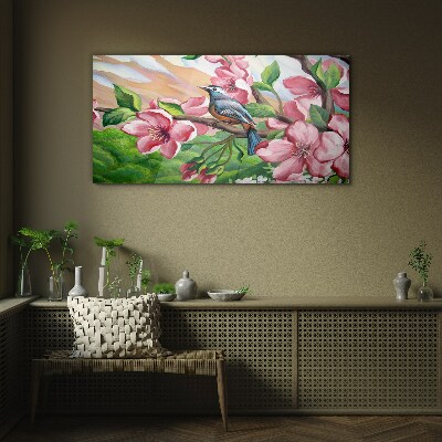 Glas foto Een vogel tegen een achtergrond van lentebloemen