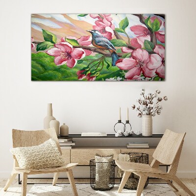 Glas foto Een vogel tegen een achtergrond van lentebloemen