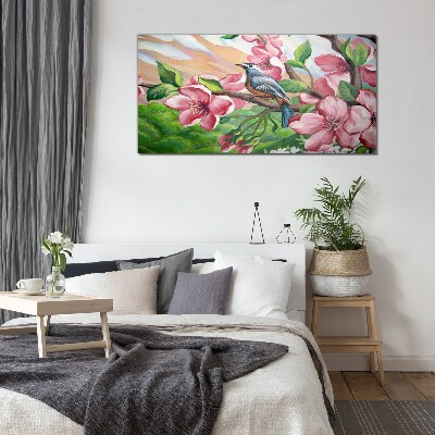 Glas foto Een vogel tegen een achtergrond van lentebloemen