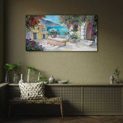 Foto op glas Een kustplaats in bloemen