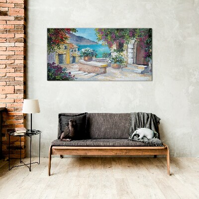 Foto op glas Een kustplaats in bloemen