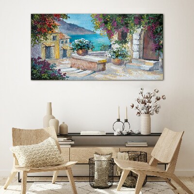 Foto op glas Een kustplaats in bloemen