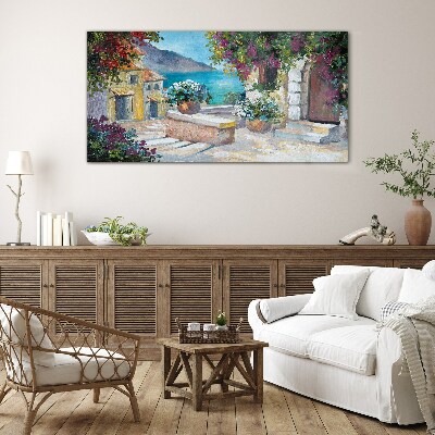 Foto op glas Een kustplaats in bloemen