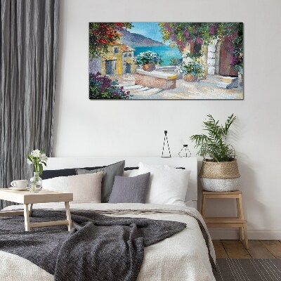 Foto op glas Een kustplaats in bloemen