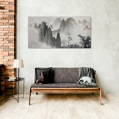 Foto op glas Berglandschap in een mistig landschap